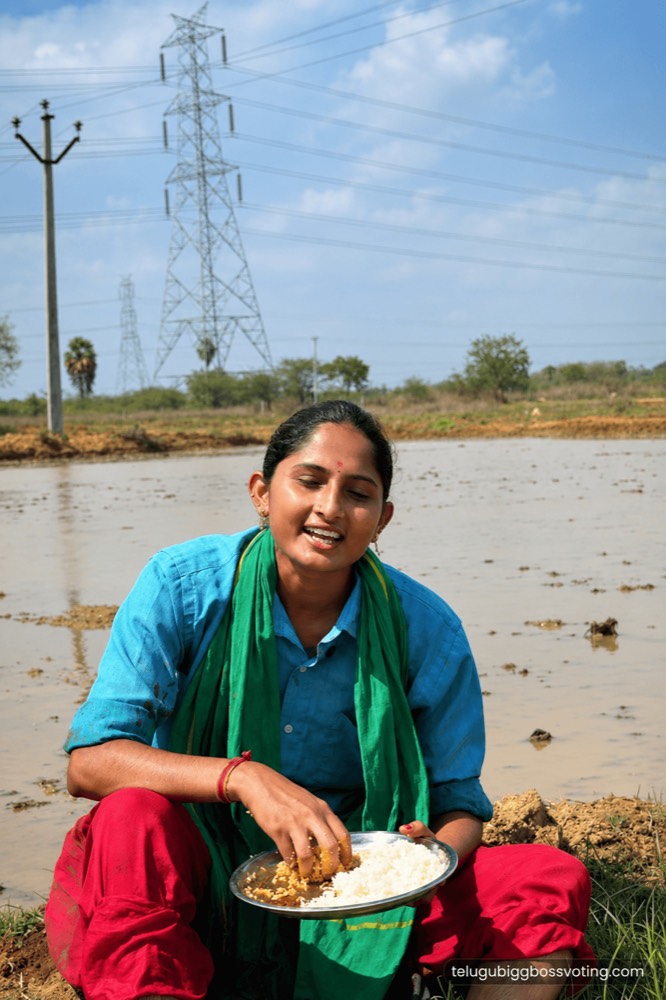 Illustrated portrait of Singer Jhansi eating lunch beside a flooded field, work clothes splashed with mud